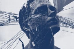 Grey and white picture of man's head crisscrossed with strings.