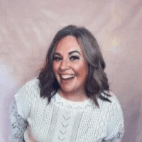 Woman smiling in white blouse
